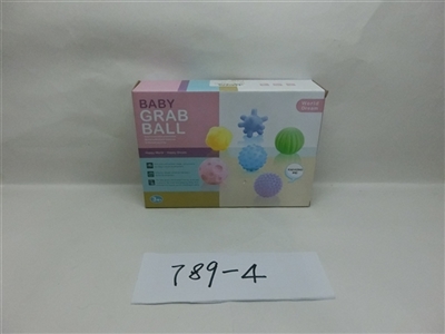 Baby squeezing the ball - OBL705554