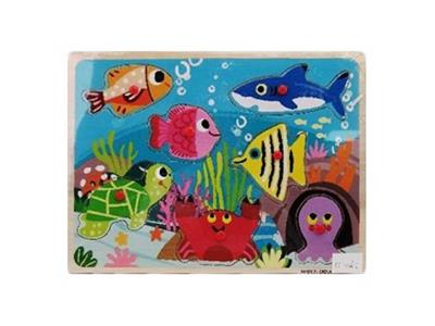 Hand grasping the wooden ocean puzzles - OBL806222