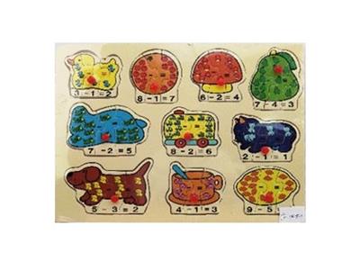 Hand grasping the wooden animal puzzles - OBL806236