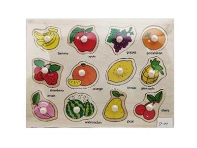 Hand grasping the wooden fruit puzzles - OBL806437