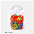 OBL619036 - Hand holding bagged snowflakes 