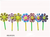 OBL683281 - A single small sunflower flowers windmills