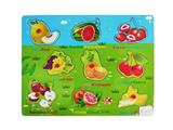 OBL806434 - Hand grasping the wooden fruit puzzles